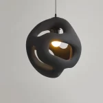 Wabi-Sabi Elegance: White Sphere Pendant Light with Twisted Design - Image 9