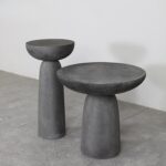 Sleek Contrast: Round Coffee Table with Textured Base and Bold Finish