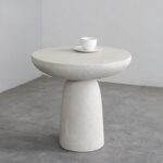 Sleek Contrast: Round Coffee Table with Textured Base and Bold Finish - Image 8